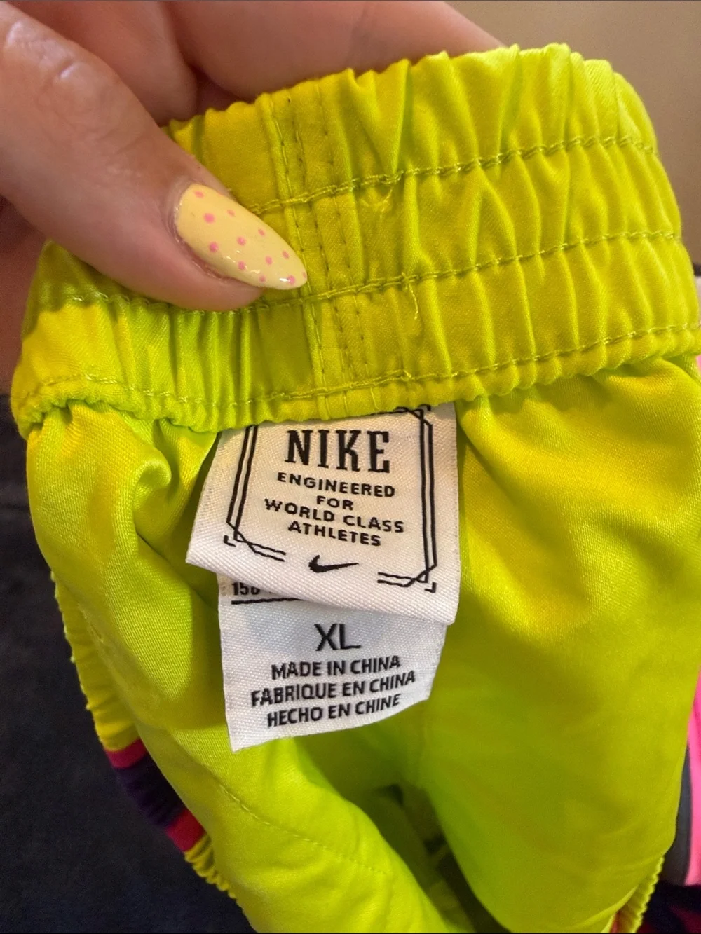 Nike Kid’s Neon Yellow Running Shorts with Pink Trim and Purple Accents